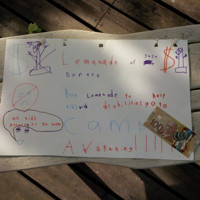 Hand drawn poster advertising a lemonade stand in support of Camp Awakening