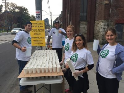Group of volunteers working the water station at the Scotiabank Toronto Waterfront Marathon